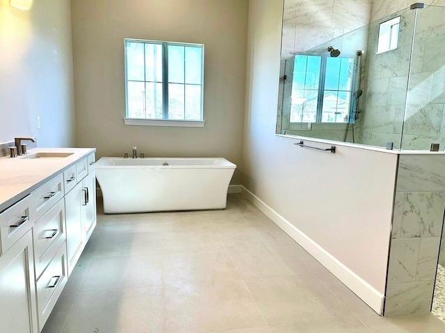 bathroom with tile patterned floors, vanity, and shower with separate bathtub