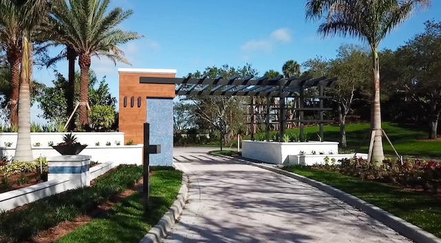 view of home's community with a pergola