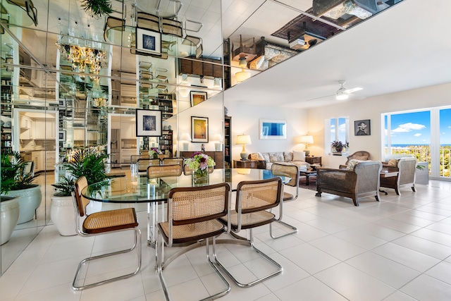 dining area featuring light tile patterned floors and ceiling fan