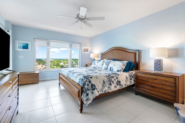 tiled bedroom with ceiling fan