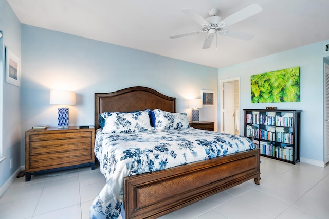 tiled bedroom with a closet and ceiling fan