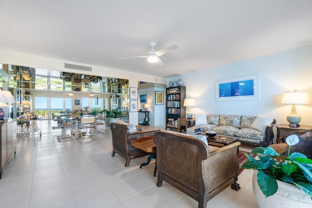 tiled living room with ceiling fan