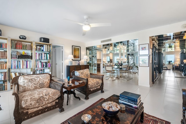 tiled living room with ceiling fan