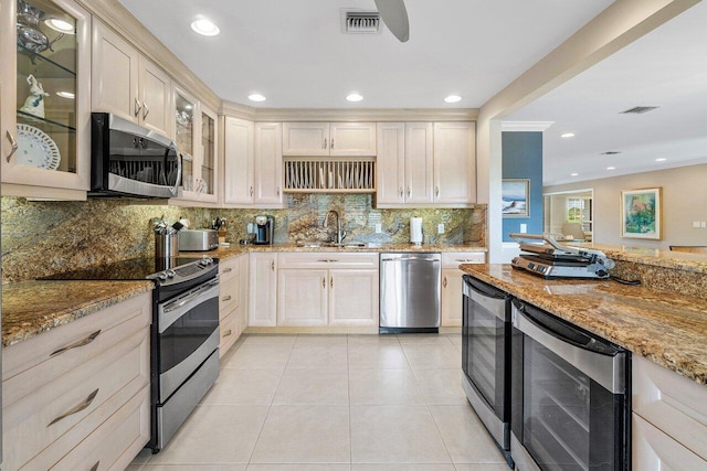 10695 Quail Covey Rd Azalea, Unit Azalea, Boynton Beach, FL 33436 - kitchen featuring appliances with stainless steel finishes, wine cooler, a sink, light stone counters, and tasteful backsplash