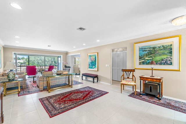 living room with crown molding and light tile patterned flooring