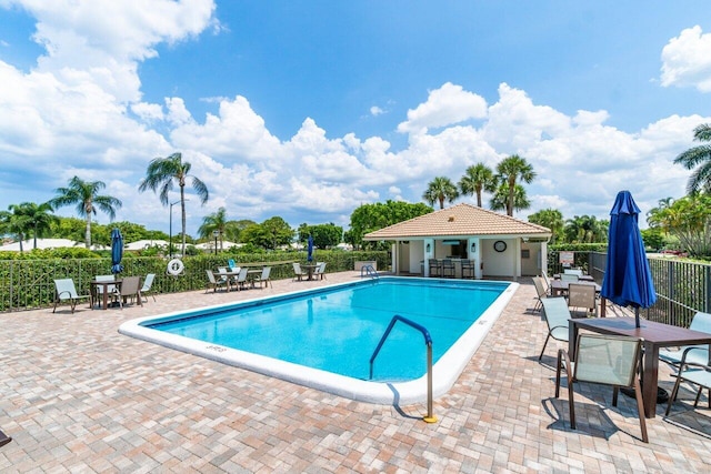 10695 Quail Covey Rd Azalea, Unit Azalea, Boynton Beach, FL 33436 - community pool with outdoor dining area and a patio
