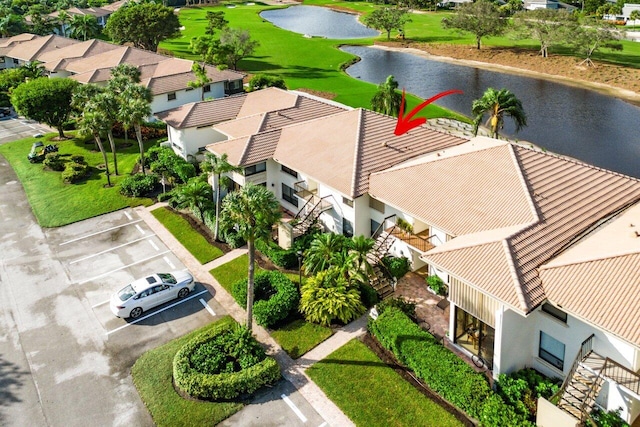 birds eye view of property with a water view