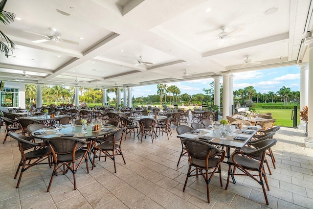 dining space featuring coffered ceiling and a wealth of natural light