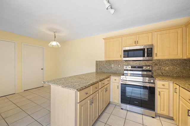 kitchen featuring backsplash, appliances with stainless steel finishes, light tile floors, and kitchen peninsula