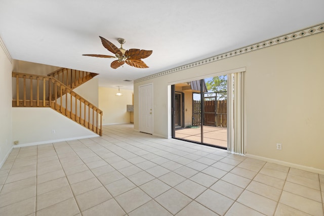 empty room with ceiling fan and light tile floors