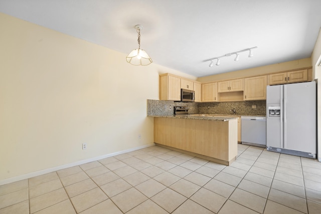 kitchen featuring track lighting, appliances with stainless steel finishes, light brown cabinetry, and light tile floors