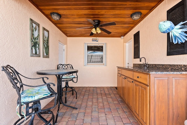 view of patio / terrace featuring sink and ceiling fan