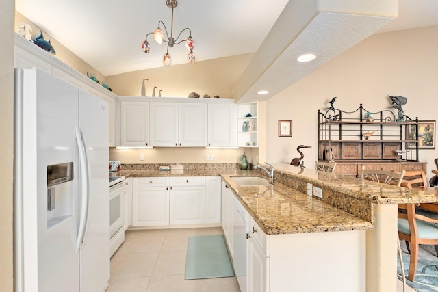 kitchen with kitchen peninsula, white cabinetry, white appliances, light tile floors, and lofted ceiling