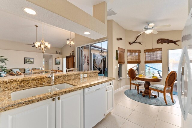 kitchen with decorative light fixtures, white cabinetry, dishwasher, and light tile floors