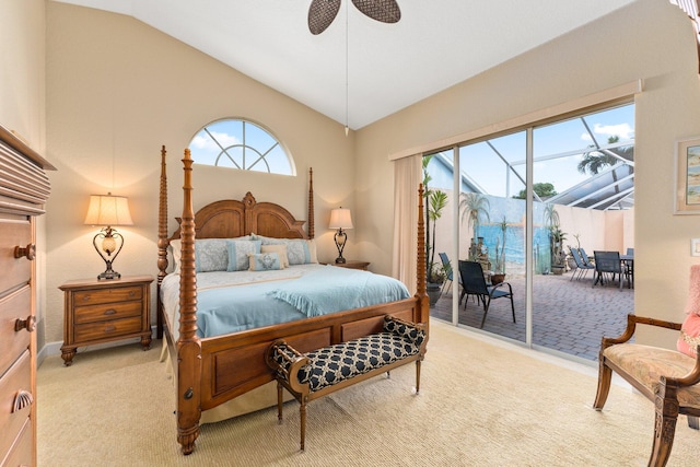 carpeted bedroom with access to outside, lofted ceiling, multiple windows, and ceiling fan