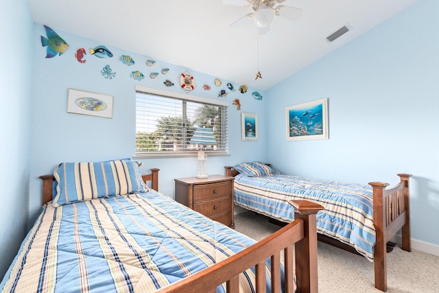 carpeted bedroom featuring ceiling fan and vaulted ceiling