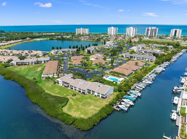 birds eye view of property featuring a water view