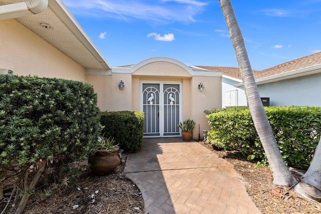 doorway to property featuring french doors