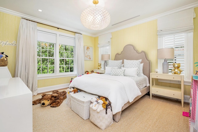 carpeted bedroom featuring a chandelier and crown molding