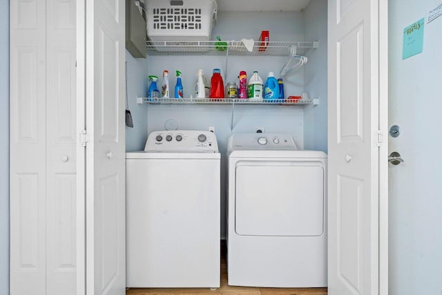 washroom featuring washing machine and dryer