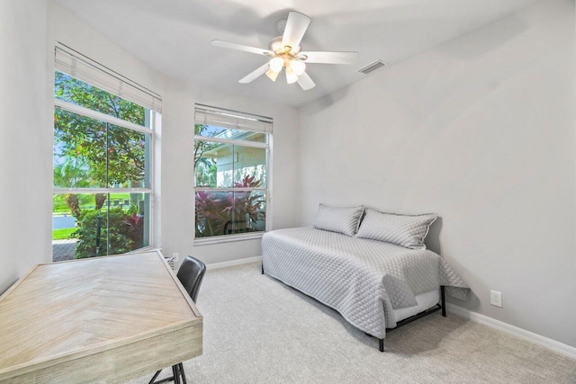 carpeted bedroom with ceiling fan