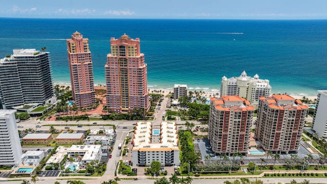 drone / aerial view featuring a beach view and a water view