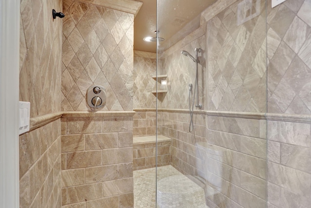 bathroom with tiled shower