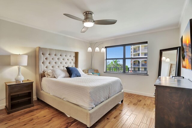 bedroom with ceiling fan, light hardwood / wood-style flooring, and ornamental molding