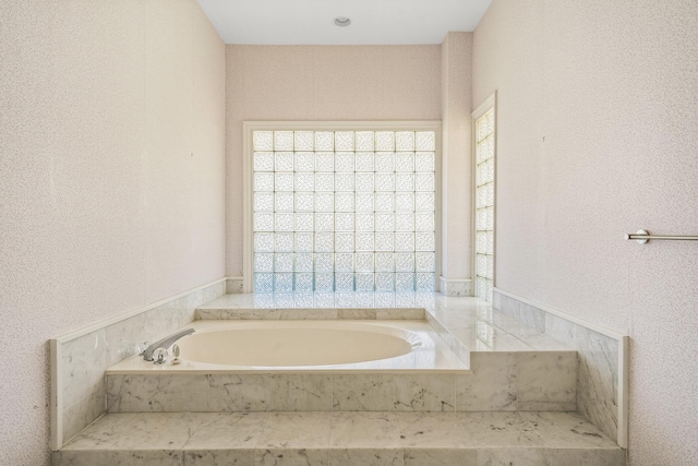 bathroom featuring a garden tub