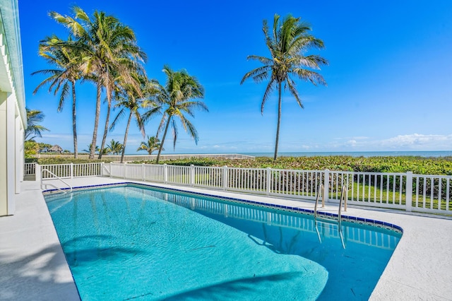 view of pool with a fenced in pool and fence