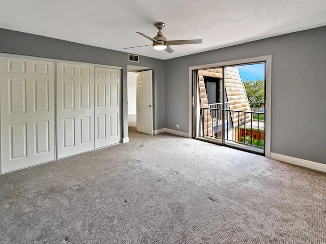 unfurnished bedroom featuring carpet flooring, a closet, ceiling fan, and access to exterior