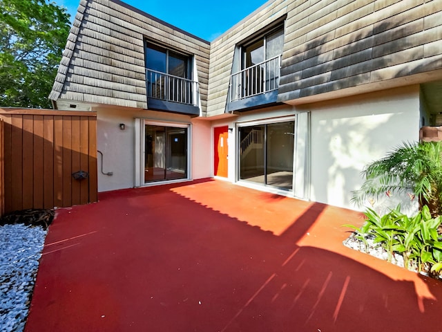 back of house with a patio