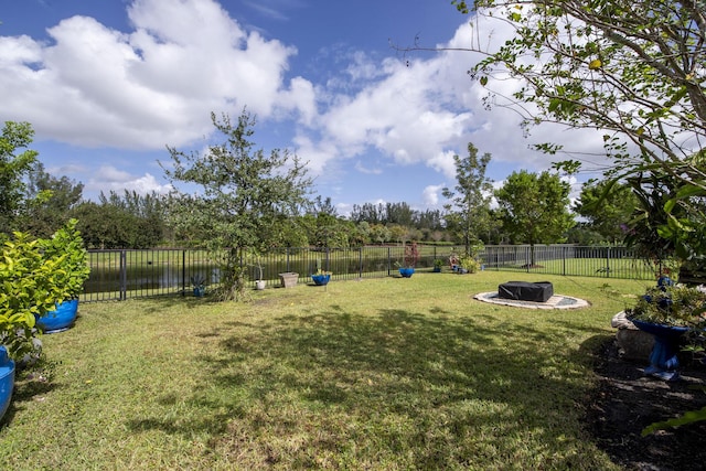 view of yard with a fire pit