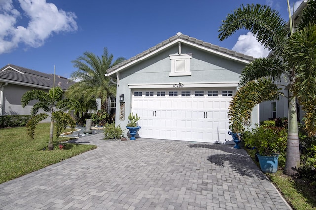 view of front facade with a garage and a front yard