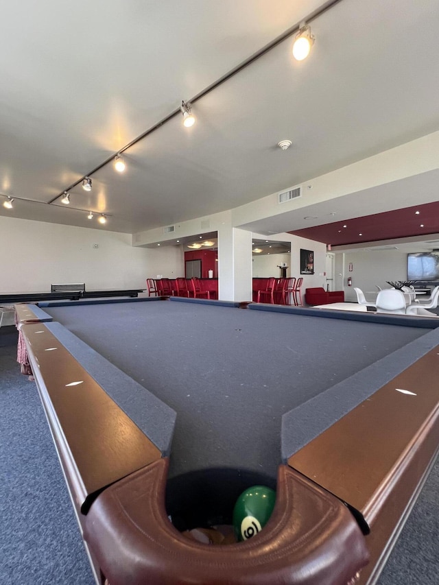 view of swimming pool featuring pool table and indoor bar