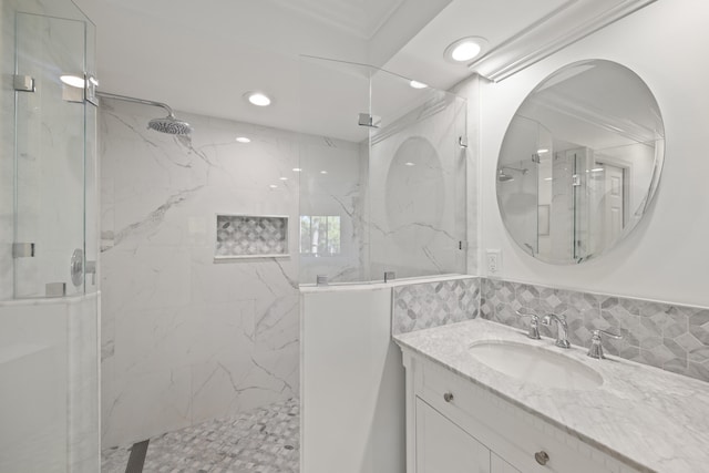 bathroom with a shower with shower door and oversized vanity