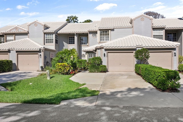 view of front facade with a front lawn and a garage