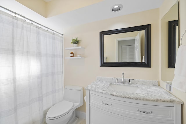 bathroom with toilet and vanity