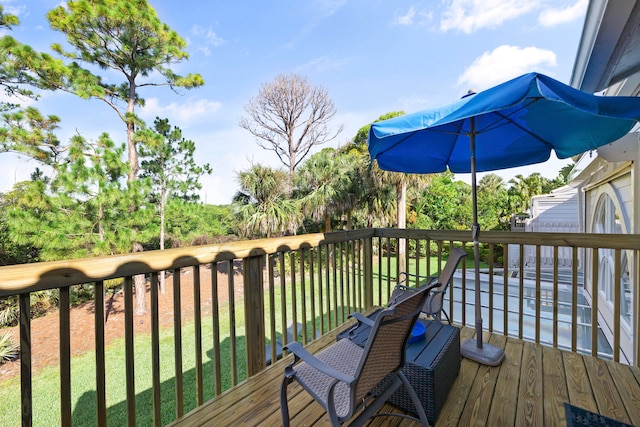 deck featuring a yard