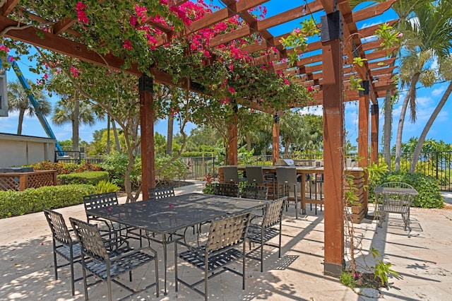 view of patio / terrace featuring a pergola and exterior bar