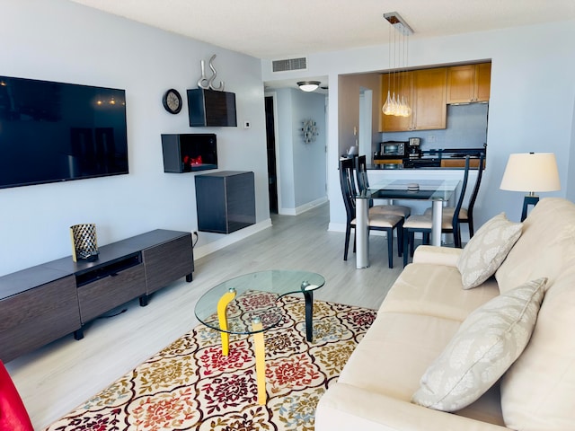 living room with light hardwood / wood-style floors