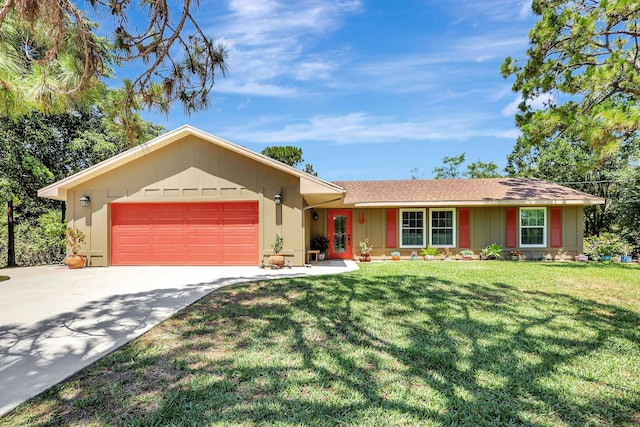 ranch-style house featuring a garage and a front yard