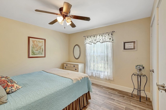 bedroom with ceiling fan and light hardwood / wood-style flooring