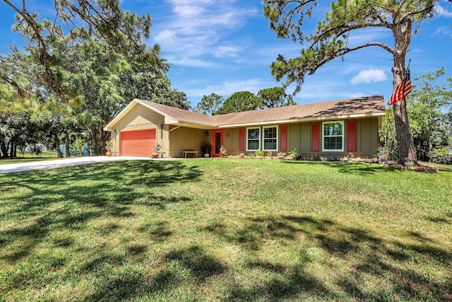 single story home featuring a garage and a front lawn