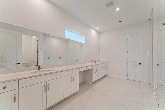 bathroom with vanity and walk in shower