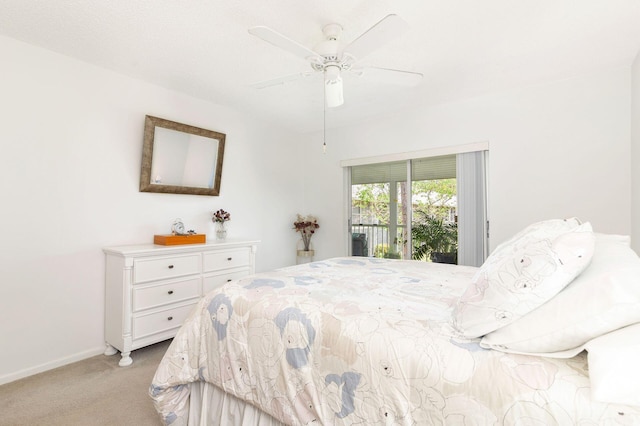 bedroom with ceiling fan, light carpet, and access to outside