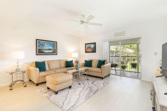 living room with ceiling fan and light hardwood / wood-style floors