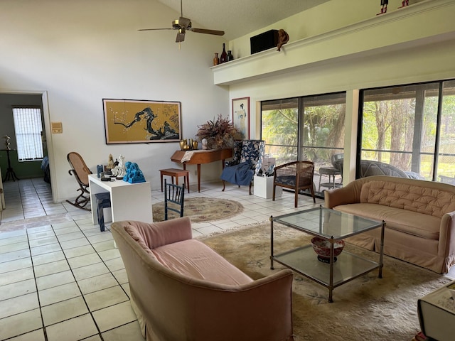 tiled living room featuring a towering ceiling and ceiling fan