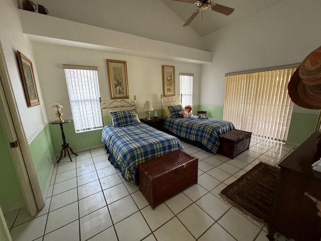 tiled bedroom featuring high vaulted ceiling and ceiling fan