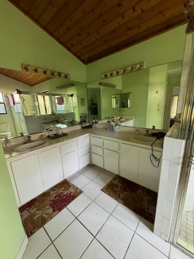 bathroom featuring wooden ceiling, double sink vanity, tile floors, and vaulted ceiling